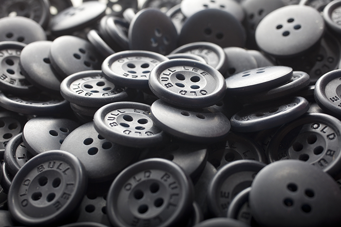 Brown buttons in a pile